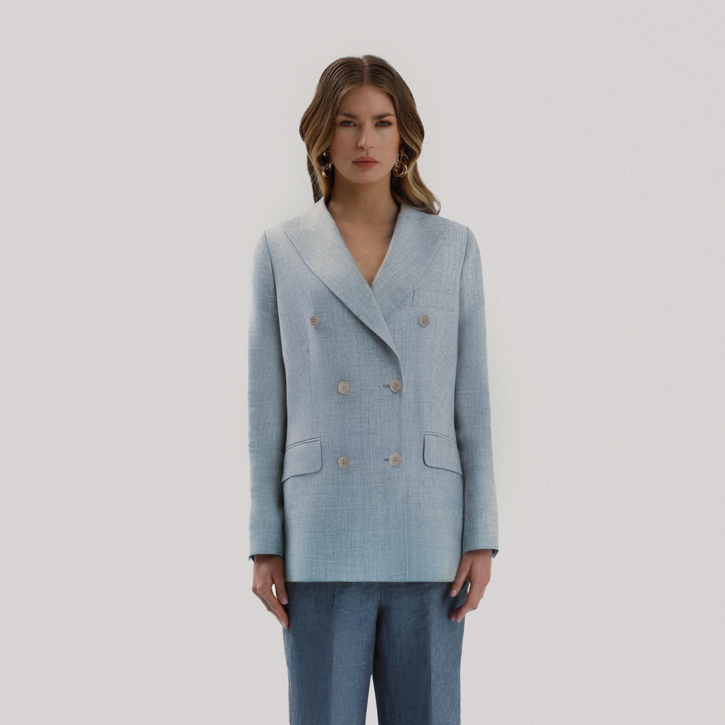 Blue double-breasted jacket with six buttons made of a blend of linen and wool