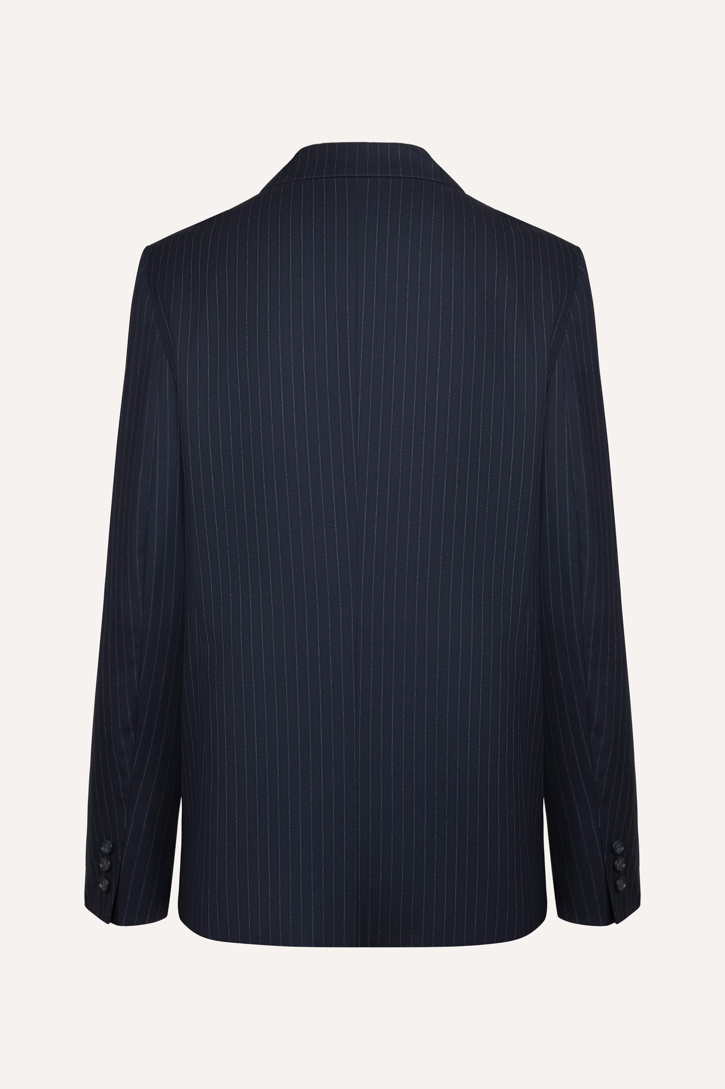 
                  
                    Navy blue wool Tennis Navy blazer with six buttons, wide lapels and slightly wider shoulders
                  
                