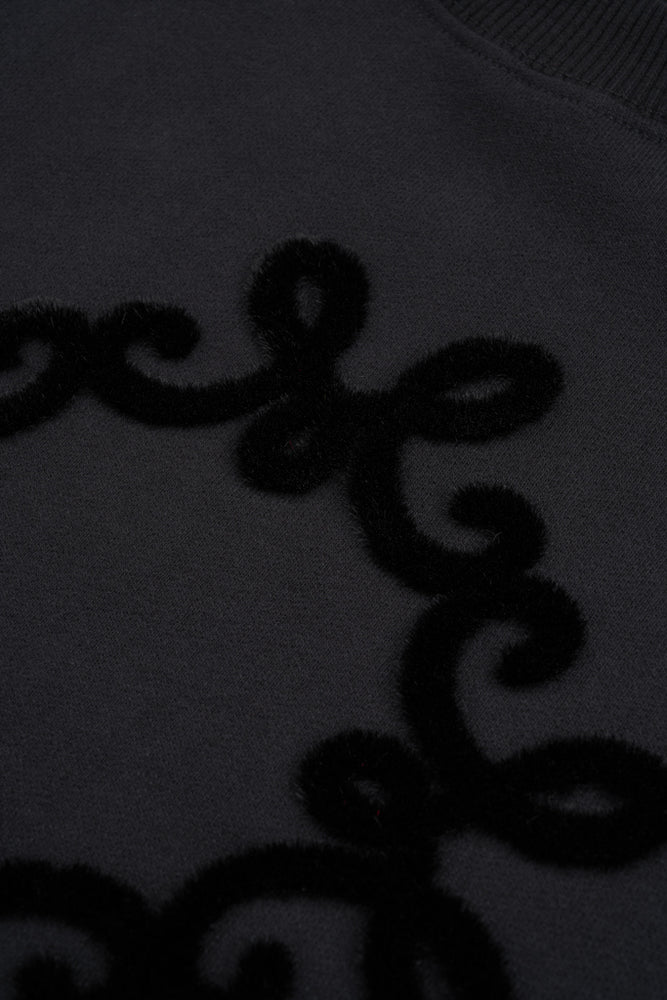 
                  
                    Czarna bawełniana bluza oversize Onera z spersonalizowany motywem MONOGRAM M
                  
                